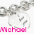 Silver chain with heart-shaped pendant displaying 'Michael' text in pink and green, showing animation change between frames.