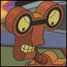 Brown cartoon character with large binoculars for eyes, yellow cracked lenses, and a wide toothy grin, set against a blurred background with blue and green tones.
