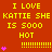 Red background with yellow text repeating 'I LOVE KATTIE SHE IS 5000 HOT' and pink heart symbols, featuring dotted lines as separators.