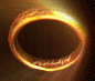 A circular golden ring with glowing edges rotates through , showing varying degrees of light intensity and partial black center
