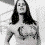 Black-and-white pixelated image of a woman with long dark hair in multiple poses, including chest-up and full-body views, with visible text 'jen' on the right side.
