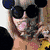 Six distinct pixelated images of a person with platinum blonde hair in various poses, outfits, and backgrounds arranged in a