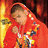 A pixelated figure in a red hooded cloak holds a glowing yellow staff against a fiery orange-red background.