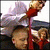 Animated sequence showing a woman in red dress with blonde hair leaning over a man's shoulder, both facing left.