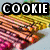 Pixelated image of a blue cookie monster with large eyes and open mouth, surrounded by cookies and text reading "COOKIE LOVES COOKIES!".