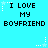 Pixelated cyan background with repeated text "I LOVE MY BOYFRIEND" in black block letters, surrounded by white star and dot animations.