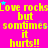 Bright pink background with yellow text repeating 'Love rocks but sometimes it hurts!!' and scattered small blue and purple stars.