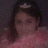 A pixelated image shows a person with dark hair and a small white star on their head, next to a bright pink background with repeated text.