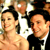 Static 50x50 pixel icon showing two people in formal attire with a bright background, likely from an event or red carpet setting.