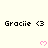 Pixelated text "Gracie <3" repeats across a with pink heart symbols below each instance on a light background