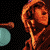 A 3x2 contact sheet of five animated frames from a music-themed buddy icon showing band members performing on stage with visible text "MELEE" in the final frame.