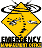 Yellow diamond-shaped sign with black border, helicopter and ship icons on left side, dotted path leading to small dark shapes below, swirling lines above the top point.