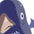 Pixelated static icon of a cartoon character with dark blue hair and brown side-swept bangs, partially visible face showing light skin tone, large white eye with black pupil, small blue fin-like appendage on right side, against transparent background.