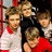 Group of people in two distinct poses with one section showing text 'M:FLY' and another featuring a person in red clothing.
