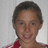 A pixelated image of a person with short brown hair wearing a red and white striped shirt against a light gray background, surrounded by green text on blue.