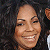 A 50x50 pixel buddy icon featuring a smiling person with curly hair on the left and green text reading "Original Icons .com" on a dark green background on the right.
