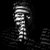 Pixelated grayscale image of a vertical object with layered horizontal segments against a black background.