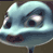 Pixelated cartoon fish with large eyes and a downturned mouth, rendered in blue and white tones on a dark background.
