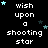 Pixelated text 'wish upon a shooting star' repeated across a black background with scattered cyan and dark blue stars, some stars animated to shift position.