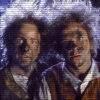 Two figures with curly hair stand side-by-side against a cloudy background, with text reading 'The Aftermath of Fangirls' on the right.