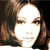 Pixelated static image of a person's face with brown hair and closed eyes, rendered in low-resolution 50x50 pixels on a dark background.