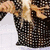 A blonde woman in a black sequined top appears in four showing her head turning from left to right