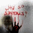 A pixelated image shows a dark hand with red question marks against a light background, with red text above the hand.