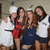 Group of five people in casual and chef attire posing together, with one person's face blurred.
