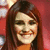 A woman with long brown hair smiles against a red background with white circular shapes, her expression changes slightly between frames.