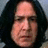 A four- with a pixelated portrait of a person with long dark hair and a serious expression, alongside red pixelated text on black backgrounds