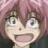 Pixelated close-up of an anime-style character with pink hair, wide eyes, and an open mouth showing teeth, set against a blurred background.
