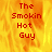 A static image with a fiery orange-yellow background and red text reading "The Smokin Hot Guy" in four vertical lines.