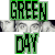 Pixelated green and black text 'GREEN' above a gray horizontal bar, with 'DAY' below it in matching style.
