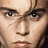 Pixelated close-up of a human face showing eyes, nose, and mouth with brown eyebrows and light skin tones.