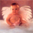 Pixelated image of a winged figure with light skin, dark hair, and closed eyes seated on clouds against a pinkish background.
