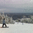 Pixelated image of a snowy landscape with a person snowboarding and text reading 'Let It Snow' on the right.