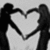 A black-and-white image of hands forming a heart shape with text reading "I Kiss You Because I Love You <3" on the right side.