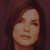 Static 50x50 pixel icon showing a close-up of a person's face with dark hair against a solid brown background, rendered in low-resolution pixel art style.