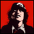 Pixelated image of a person with dark hair and light skin against red background, next to text reading AC/DC Angus Young in stylized font.