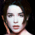 A pixelated image of a person with dark hair against a black background, next to green text reading 'Original Icons .com' on a solid green backdrop.
