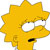 Pixelated yellow cartoon character with spiky hair, wide white eyes with black pupils, and a small open mouth showing dark interior.