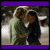 Animated sequence showing two people embracing in a snowy outdoor setting with text and heart symbols appearing across frames.