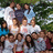 Pixelated group photo of people in front of greenery with blue pixelated text on green background reading "Cactus Corral is the place to be. Fun Slaughter is all we do! Thank you admin staff! We love you!.. is the life for me! Eating, sleeping, drinking"