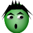 Green circular face with black spiky hair, wide eyes, and an open mouth on a gray background.
