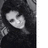 Black-and-white photo of a person with long dark hair on left; orange pixelated text on dark teal background reads "I'm actin' AS IF your love will NEVER fade" and "The ONLY fear a... Rebel HEARTknows. <3" with numbers 2, 0, 0, 7.