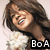Pixelated image of a person with long brown hair wearing a white top, with a black rectangular box containing white text 'BoA' in the bottom right corner.