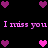 Pixelated pink text "I miss you I miss you" repeats across a black background with scattered pink and purple heart icons in multiple positions.