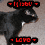 Black and white cat with red text overlays showing 'Kitty' and 'Love' in pixelated font, positioned on a beige carpet background.