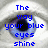 A static image of a human eye with blue pixelated text overlaid, displaying lyrics about blue eyes and heart jump.