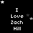 Black background with white pixelated text reading "I Love Zach Hill" arranged in a , surrounded by scattered stars of varying sizes and shades